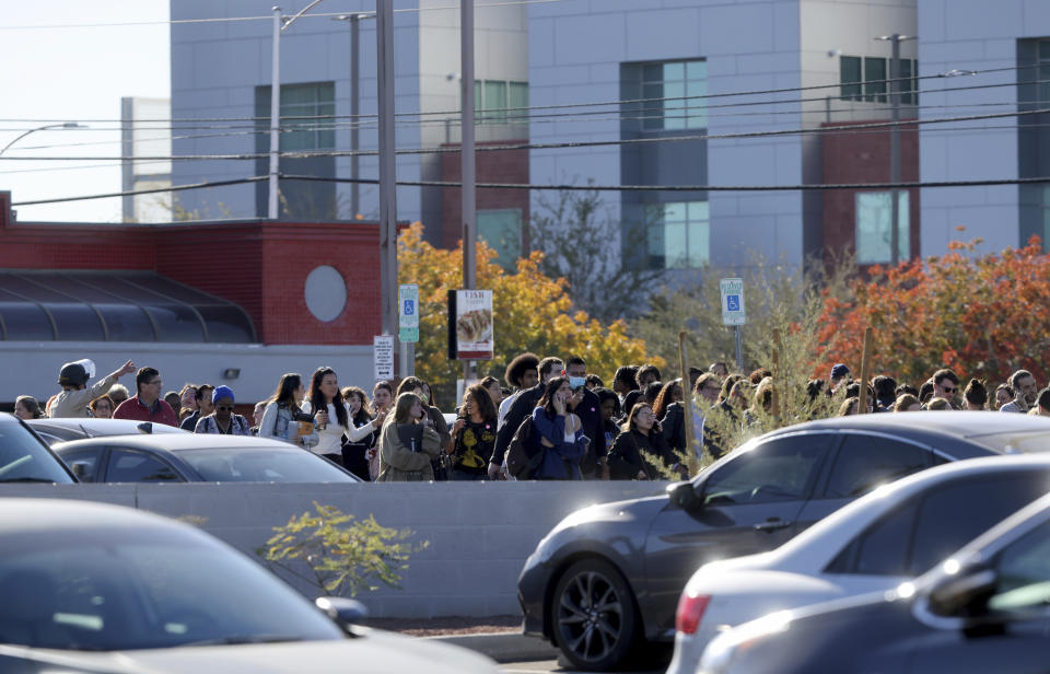 Police evacuate students near Maryland Parkway after a shooing on the University of Nevada, Las Vegas campus in Las Vegas, Wednesday, Dec. 6, 2023. The attack just before noon sent police swarming onto the campus, which is just a couple of miles from the world-famous Las Vegas Strip while students barricaded themselves in classrooms. (K.M. Cannon/Las Vegas Review-Journal via AP)