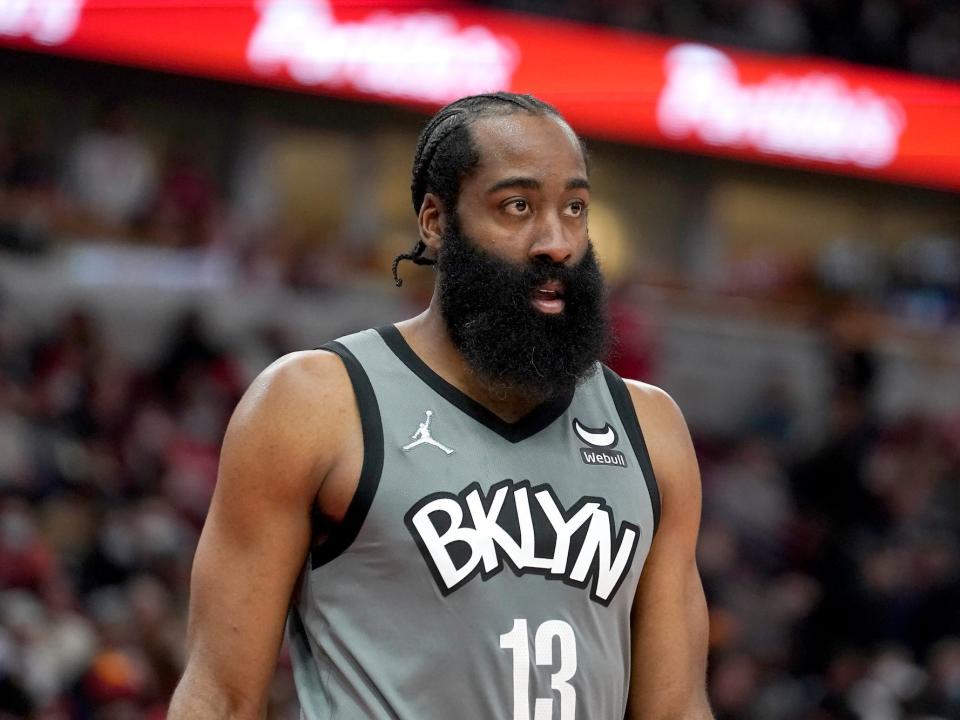 James Harden looks on during a Nets game in 2022.