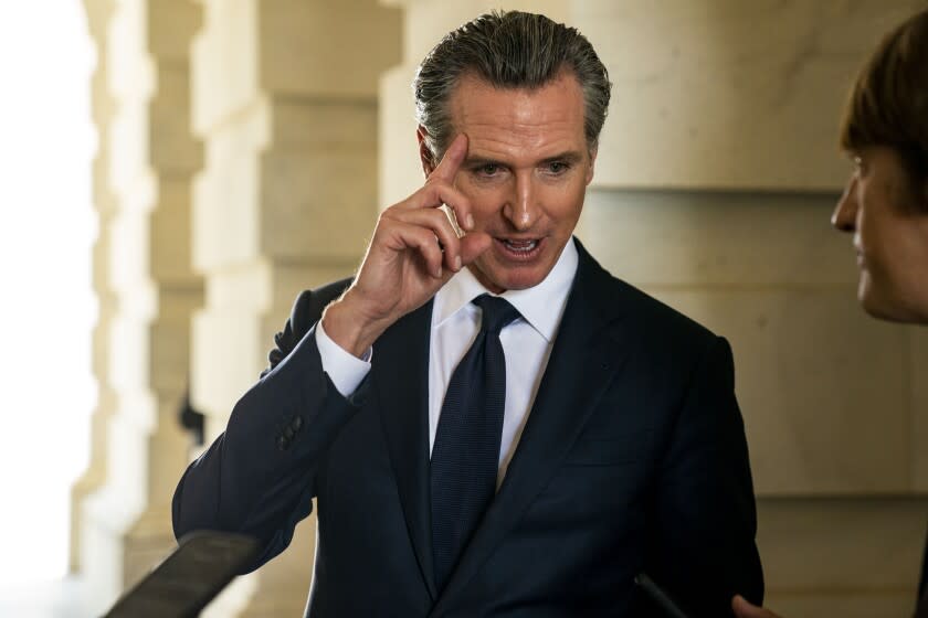 California Governor Gavin Newsom speaks with reporters in the Senate Carriageway of the U.S. Capitol Building