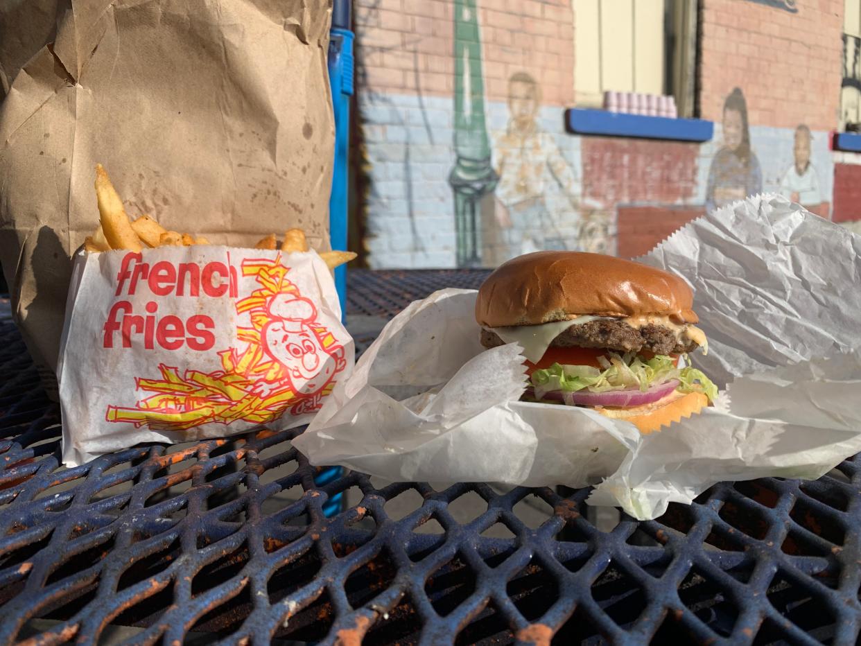 An Ollie Burger and fries from Ollie's Trolley.