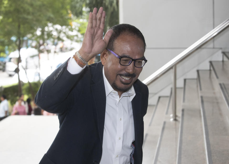 Wiputalaeng Patanapumithai, one of the leaders of Red Shirt, arrives at the Bangkok Criminal Court in Bangkok, Thailand, Wednesday, Aug. 14, 2019. The court has dismissed charges of terrorism and other offenses against 24 leaders of an extended street protest in 2010 that saw key parts of central Bangkok closed off and random violence that was ended by armed military force. (AP Photo/Sakchai Lalit)