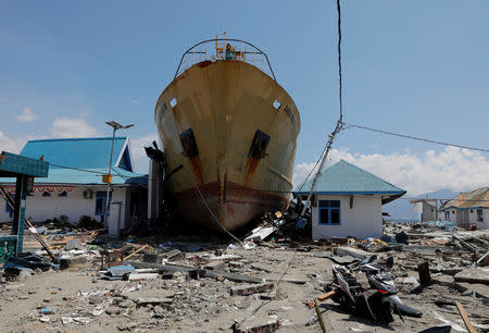 A stranded ferry is seen on the land after being hit by tsunami at Wani village in Donggala regency, Sulawesi island, Indonesia, October 2, 2018. REUTERS/Beawiharta