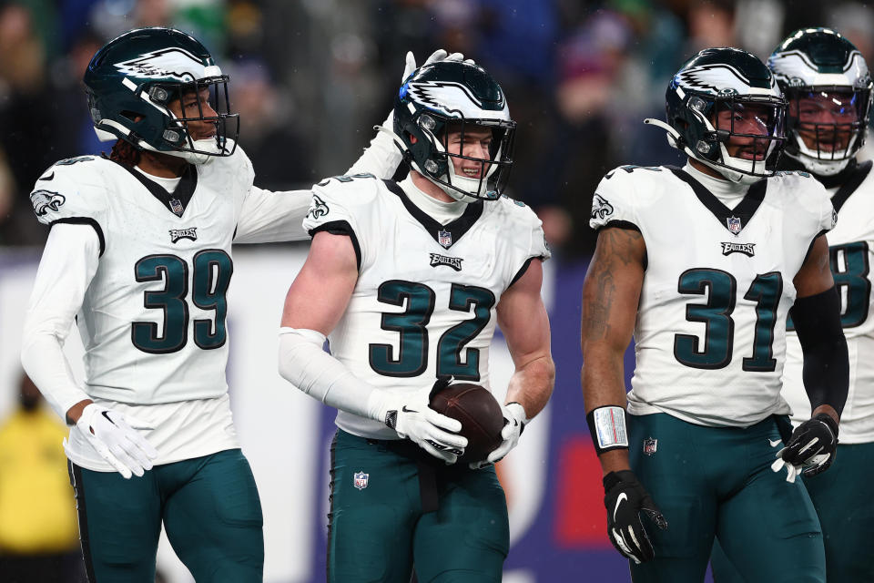 EAST RUTHERFORD, NEW JERSEY – JANUARY 07: Reed Blankenship #32 of the Philadelphia Eagles celebrates an interception with Eli Ricks #39 during the second quarter in the game against the New York Giants at MetLife Stadium on January 07, 2024 in East Rutherford, New Jersey. (Photo by Elsa/Getty Images)