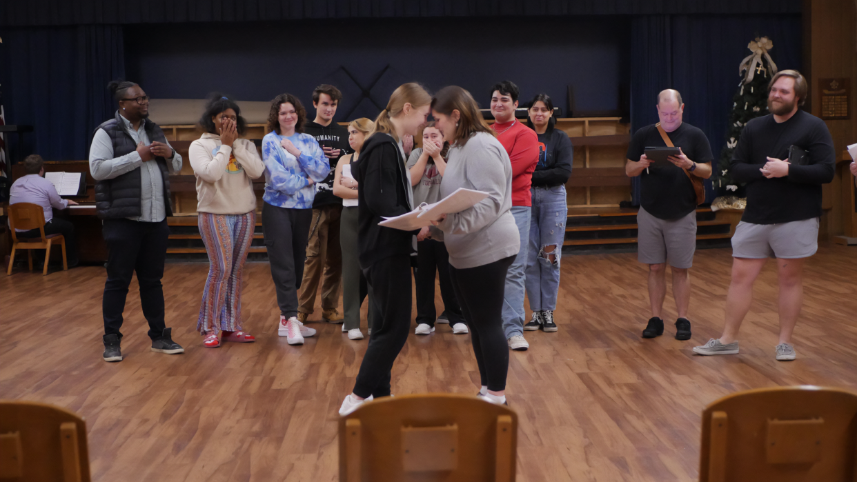 The cast of "The Prom" celebrating Emma and Alyssa during rehearsal of the Quincy Music Theatre and Newstage Theatreworks’ production, which runs Jan 18-21, 2024.