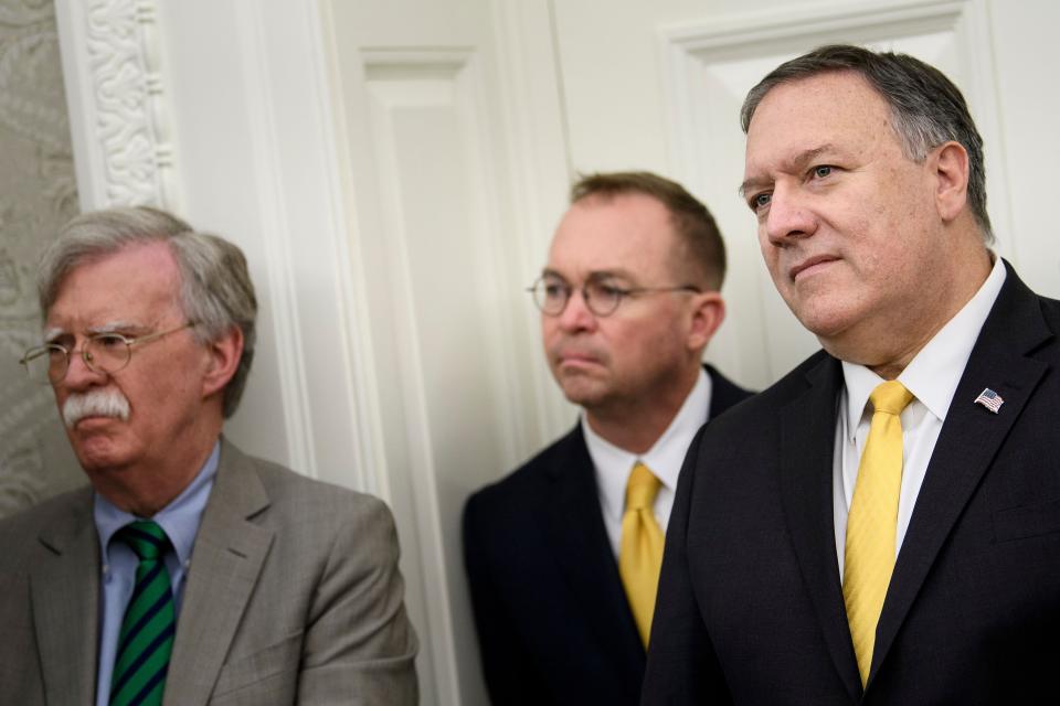 National Security Advisor John R. Bolton (left), acting White House Chief of Staff Mick Mulvaney (center) and Secretary of State Mike Pompeo. (Photo: BRENDAN SMIALOWSKI via Getty Images)