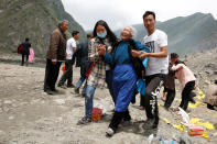 <p>Relatives of victims react at the site of a landslide in the village of Xinmo, Mao County, Sichuan Province, China, June 26, 2017. (Photo: Aly Song/Reuters) </p>