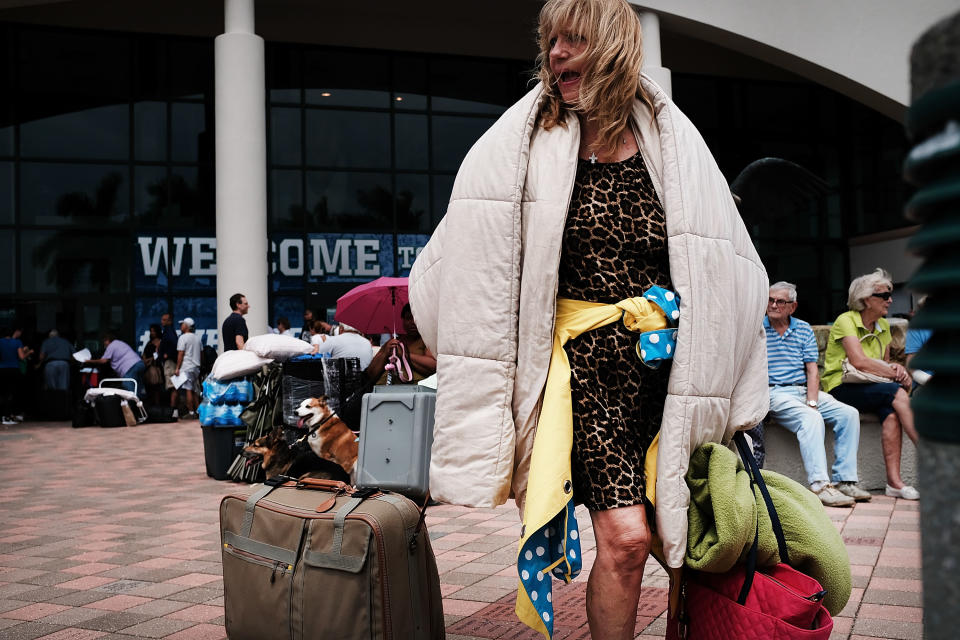 <p>A woman arrives at a shelter at Alico Arena where thousands of Floridians are hoping to ride out Hurricane Irma on Sept. 9, 2017 in Fort Myers, Fla. (Photo: Spencer Platt/Getty Images) </p>