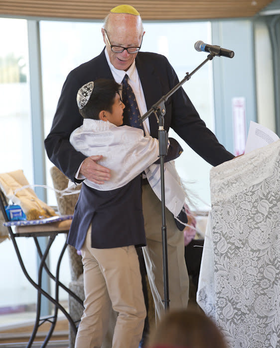 The author's late husband with their son becoming a Bar Mitzvah in 2014.&nbsp;He is missed in the smallest of ways, including as the homework kin. (Photo: Courtesy of Robert Durell)