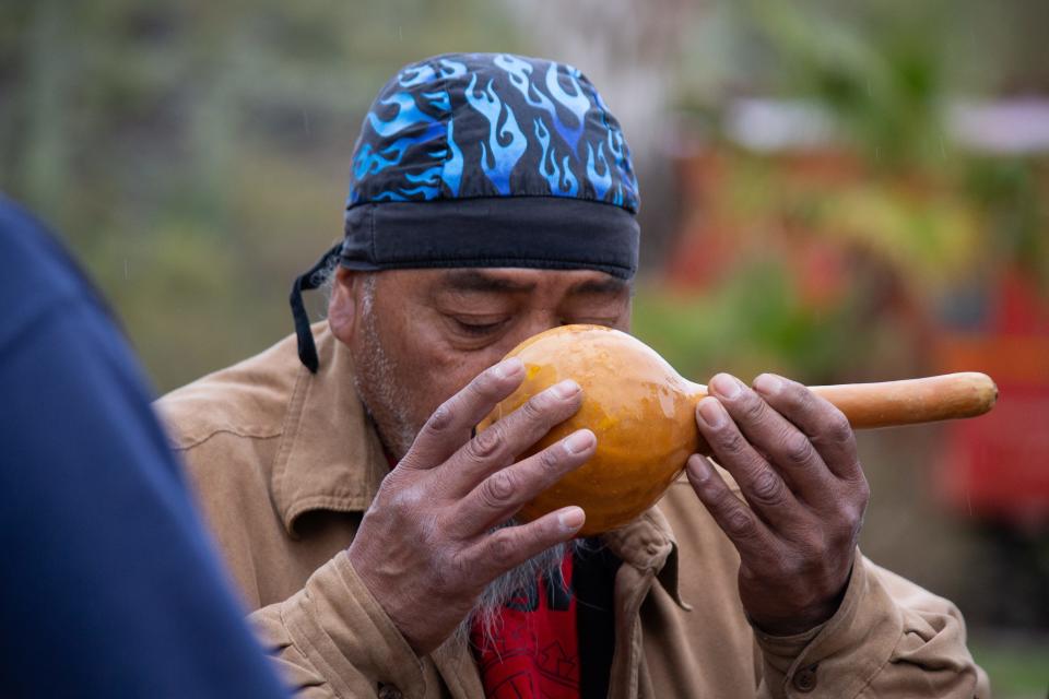 Bryant Smith Jr., a Hualapai tribe member, drinks from the holy water of Ha'Kamwe during a ceremony.