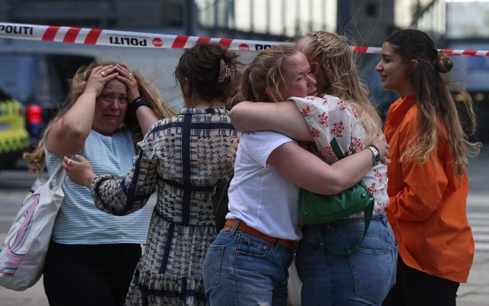 Emotional scenes as crowds escape the shooting on Sunday - OLAFUR STEINAR GESTSSON/Ritzau Scanpix/AFP