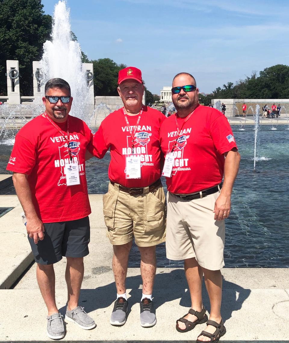 U.S. Marine veterans Scott and Jeff Lutterbeck  with their father, Jerry, whose 80th birthday coincided with the date of their honor flight to Washington.