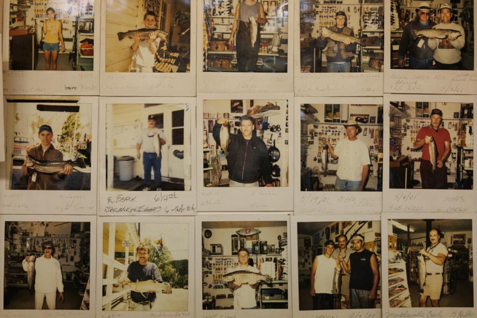 A series of Polaroids of people holding fish they've caught