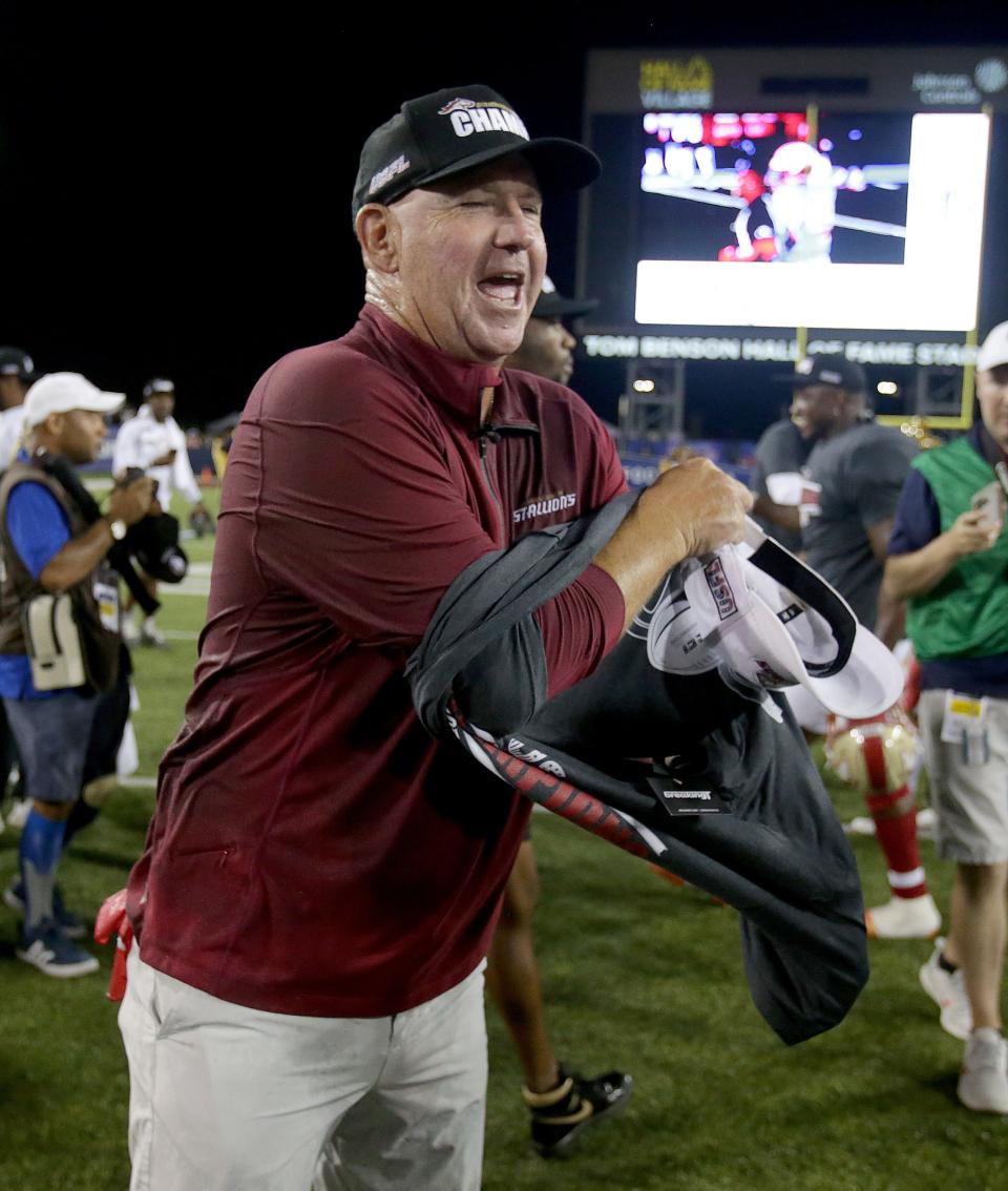 The Birmingham Stallions head coach Skip Holtz changes into a USFL champions T-shirt during as he and his team celebrate their USFL championship after beating the Philadelphia Stars at Tom Benson Hall of Fame Stadium in Canton last year.