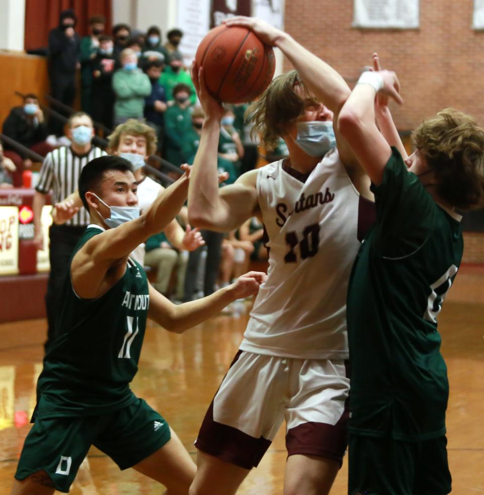 Joseph Landry is under pressure from Aiden Yim and Aiden Smith Friday in Bishop Stang's 63-49 win over Dartmouth at the John C. O'Brien Gymnasium.