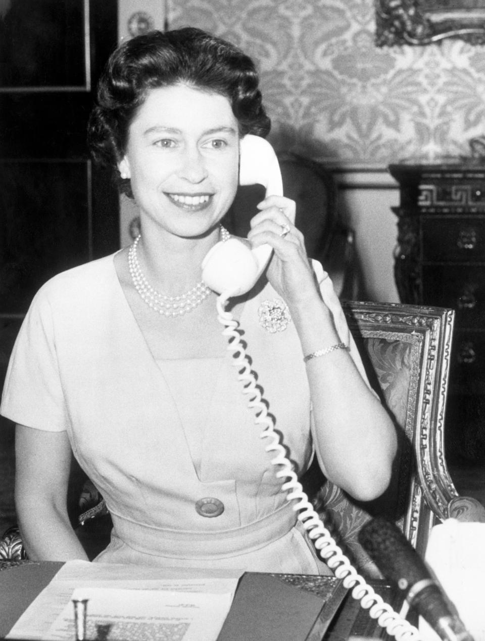 <p>John Diefenbaker, Prime Minister of Canada, receives the first ever phone call to Ottawa from the Queen. She was inaugurating the CANTAT (Canadian Trans-Atlantic Telephone). (PA Archive) </p>