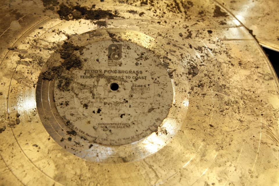 FILE -This Feb. 23, 2010 file photo, shows a gold record of Philadelphia native Teddy Pendergrass that was recovered in the aftermath of a fire at Philadelphia International Records in Philadelphia. Officials said the two-alarm fire destroyed about 40 percent of the memorabilia but spared the recording studio that gave birth to the "Sound of Philadelphia." Developer Carl Dranoff wants to construct a 47-story building on the studio site called SLS International that would be part hotel, part luxury condos. The project in the heart of downtown would require demolishing the longtime home of Philadelphia International Records. (AP Photo/Matt Rourke, File)