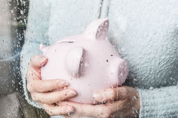 CRHKHT Woman with piggy bank at rainy window woman; Piggy; Bank; raining; window; adult; drizzling; adult; drizzling; female; ga