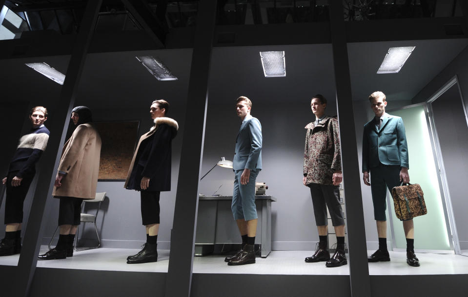 Models wear creations by French fashion designer Guillaume Henry for Carven's fall-winter 2013/2014 men's fashion collection, presented in Paris, Wednesday, Jan.16, 2013. (AP Photo/Zacharie Scheurer)