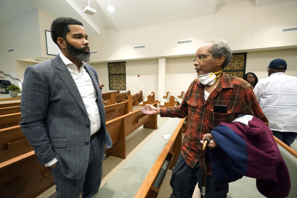 Ronald Gilbert, right, former operations supervisor at the O. B. Curtis Water Treatment Plant, shares with Jackson Mayor Chokwe Antar Lumumba his experience of working at the water treatment plant during a community meeting held at College Hill Missionary Baptist Church, Tuesday, Sept. 13, 2022. (AP Photo/Rogelio V. Solis)