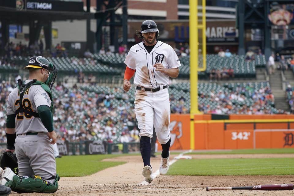 Detroit Tigers' Jake Marisnick scores during the fourth inning of a baseball game against the Oakland Athletics, Thursday, July 6, 2023, in Detroit. (AP Photo/Carlos Osorio)