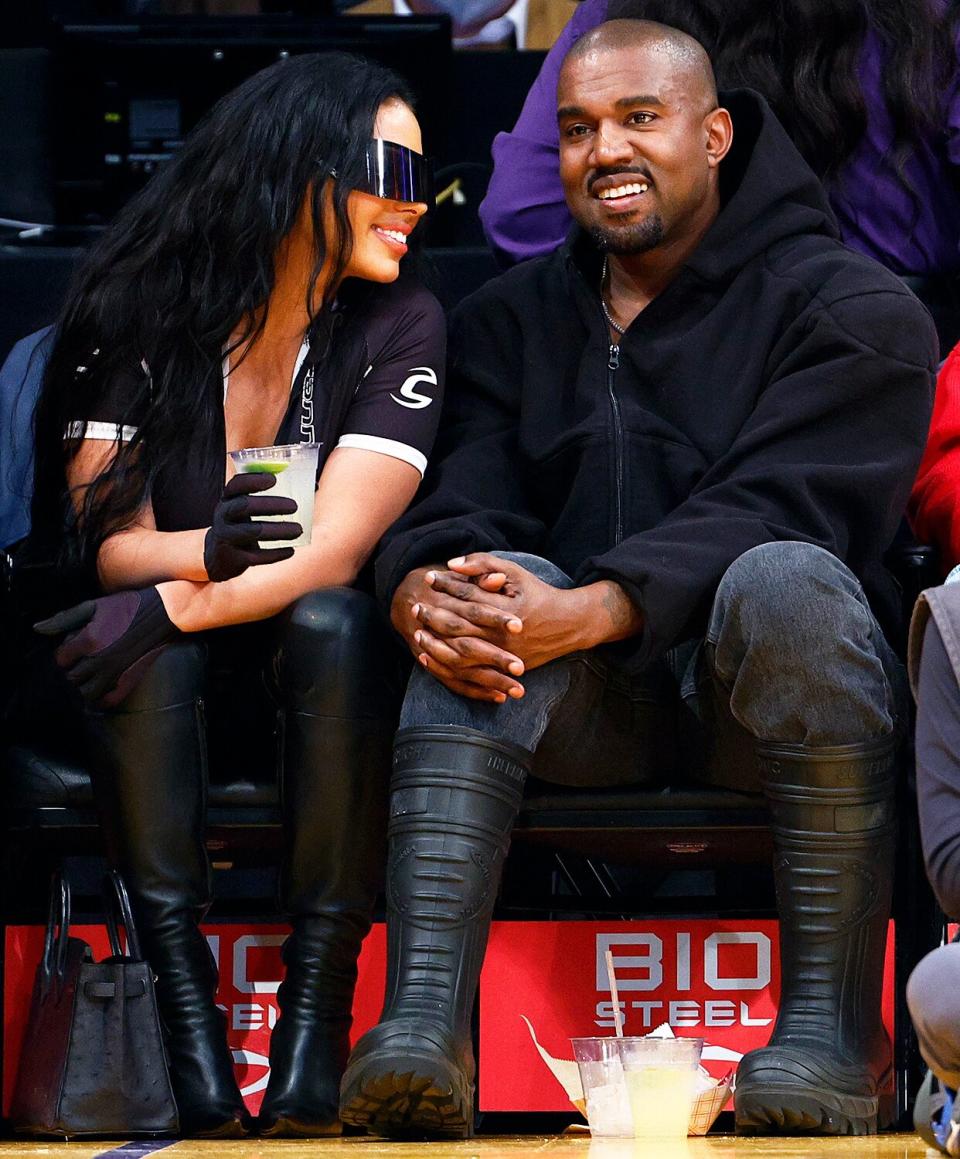 Rapper Kanye West and girlfriend Chaney Jones attend a game between the Washington Wizards and the Los Angeles Lakers in the fourth quarter at Crypto.com Arena on March 11, 2022 in Los Angeles, California.