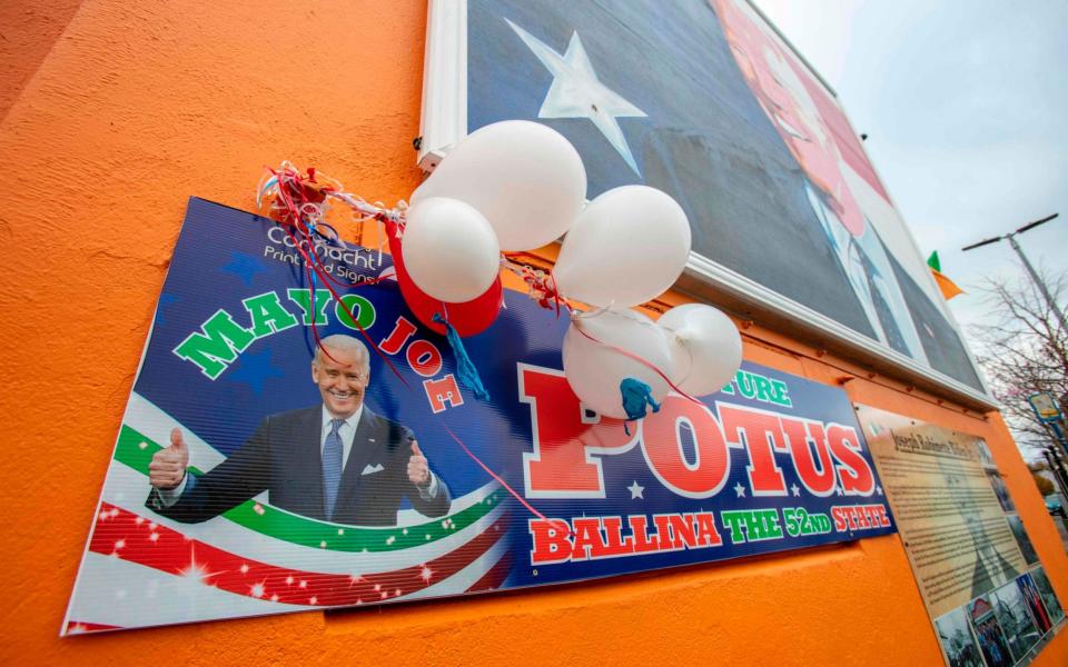 A poster shows support to US president-elect Joe Biden in his ancestral hometown of Ballina in County Mayo - PAUL FAITH/AFP