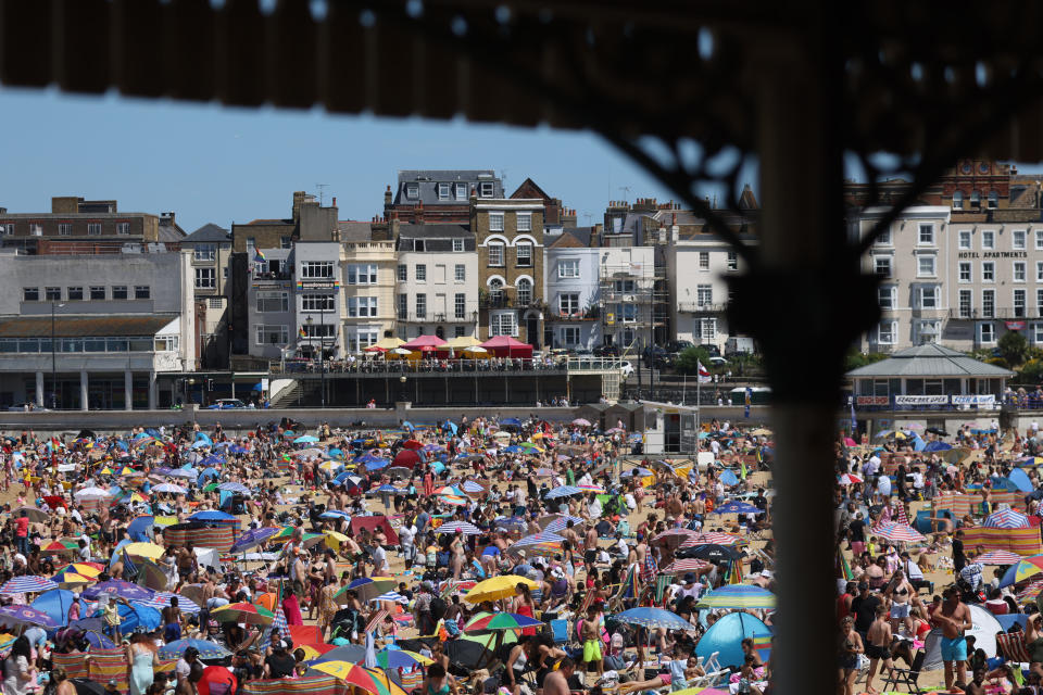 MARGATE, ENGLAND - JULY 16: People enjoy the hot weather at Margate beach on July 16, 2022 in Margate, United Kingdom. Britain is experiencing a heatwave this week as temperatures in some parts are expected to reach between 37c and 40c. A level 3 heat health alert has been issued for the south and eastern parts of England, rising to level 4 by Monday. (Photo by Hollie Adams/Getty Images)