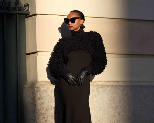 Black woman wearing a light orange blazer with a black shirt and black  trousers - casual look Stock Photo by wirestock