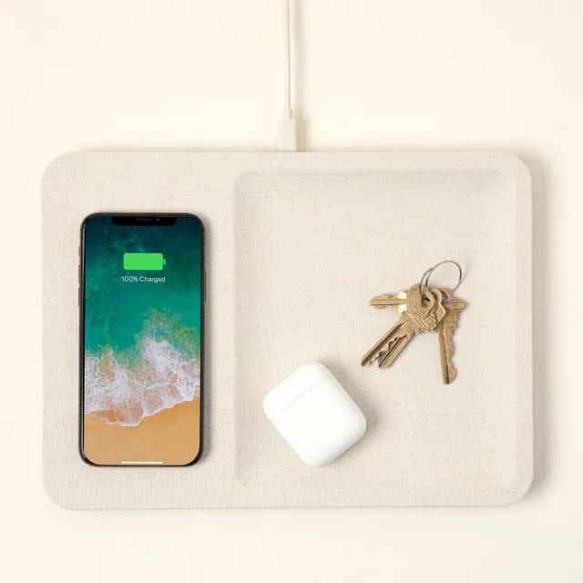 <p><a href="https://www.uncommongoods.com/product/linen-wireless-phone-charger" rel="nofollow noopener" target="_blank" data-ylk="slk:Shop Now;elm:context_link;itc:0;sec:content-canvas" class="link rapid-noclick-resp">Shop Now</a></p><p>Linen Wireless Phone Charger</p><p>uncommongoods.com</p><p>$40.00</p>