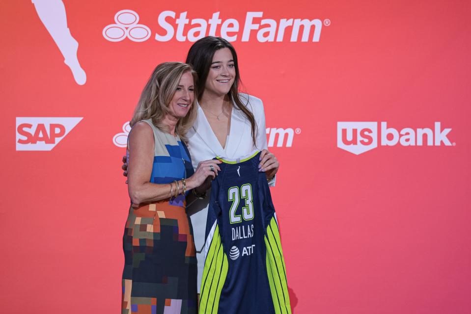 Villanova star Maddy Siegrist poses for a photo with WNBA Commissioner Cathy Engelbert after being drafted third overall by the Dallas Wings.