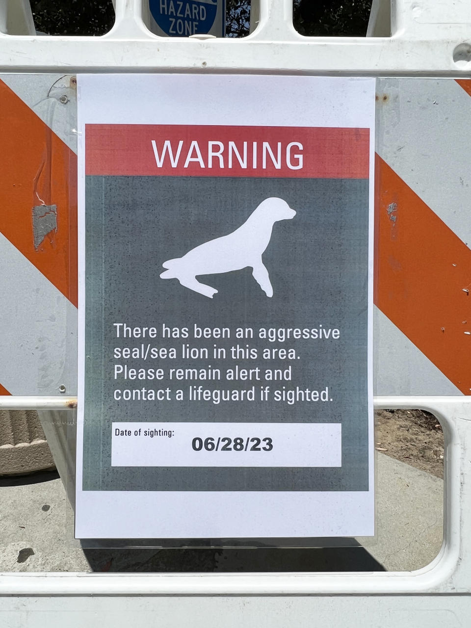 A sign warning people of an aggressive seal/sea lion along the Dana Strands Beach area in Dana Point, Calif., on June 28, 2023. (Courtesy John Kubota)