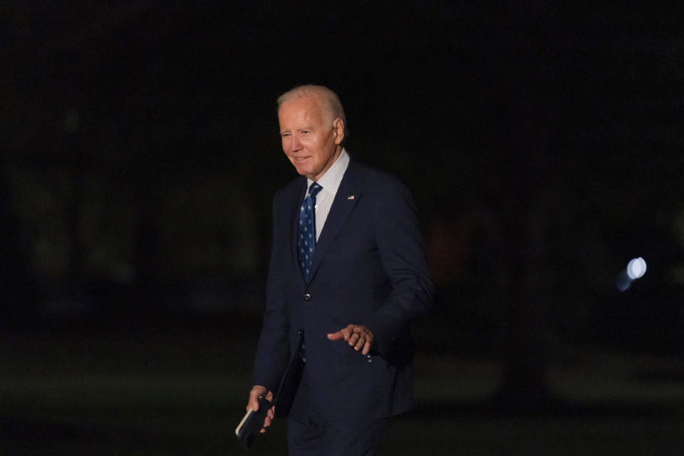 President Joe Biden waves to reporters after arriving on Marine One on the South Lawn of the White House, Thursday, Nov. 9, 2023, in Washington. Biden is returning to Washington after meeting with United Auto Workers and attending a campaign reception in Illinois. (AP Photo/Stephanie Scarbrough)