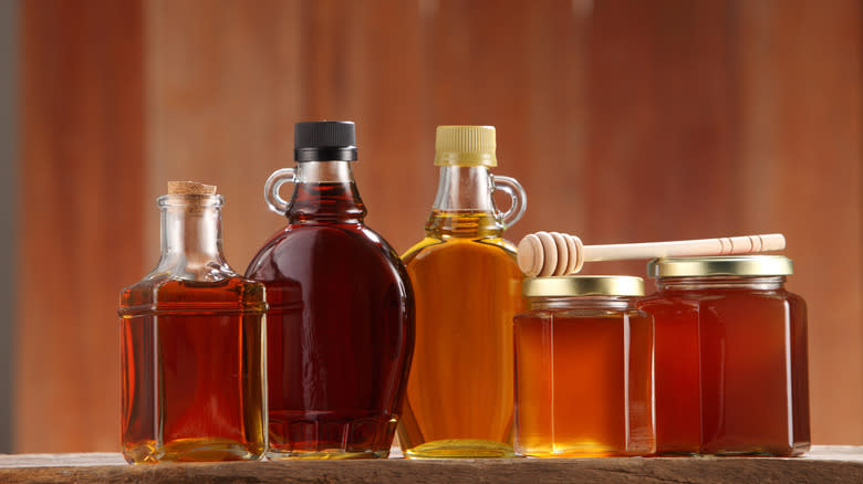 assorted sweeteners in glass jars