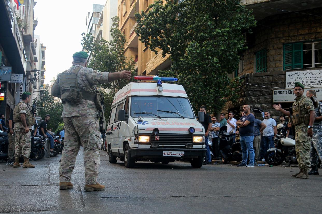 Beirut, Lebanon. 17th Sep, 2024. Lebanese army soldiers secure the area for an ambulance to enter the premises of the American University hospital. Eight people have been killed and some 2,750 injured in suspected coordinated explosions of hand-held telecommunications devices across Lebanon, Health Minister Firas Abiad said during a press conference in Beirut on 17 September. Credit: Marwan Naamani/dpa/Alamy Live News