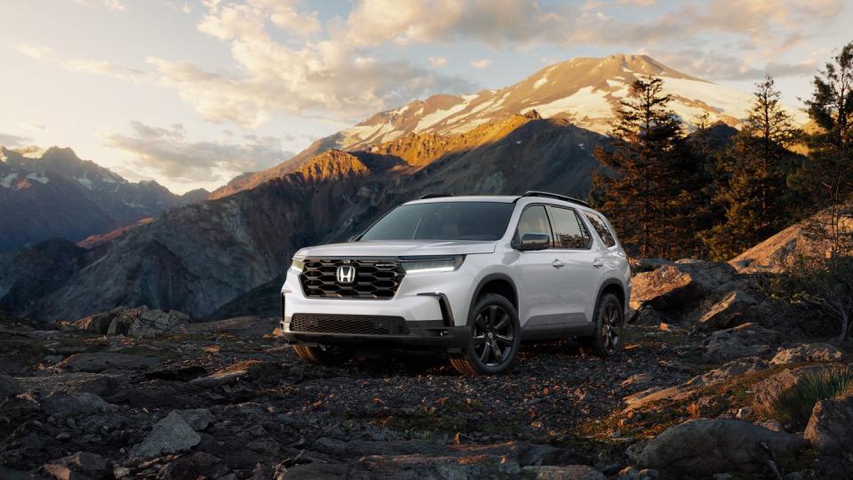 2025 honda pilot black edition painted white in front of mountain