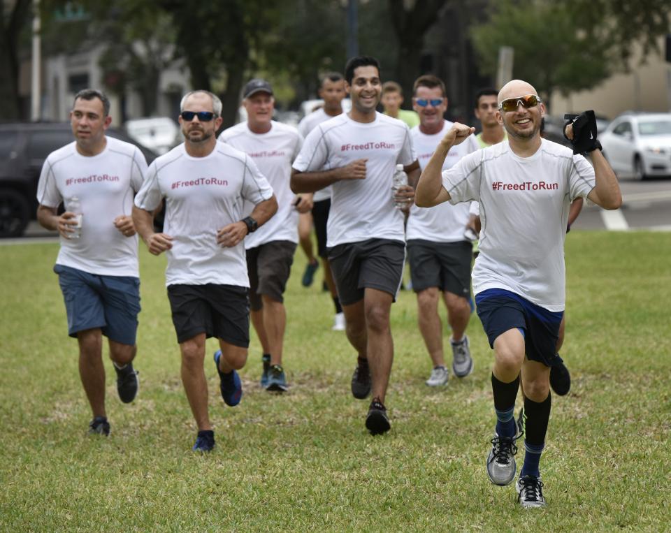In 2017, Jacksonville attorney Mike Freed (right) leads a group of supporters as he finishes the first Freed to Run, a six-day, six marathon run from Tallahassee to the Duval County Courthouse. The annual event raised money for Jacksonville Area Legal Aid.