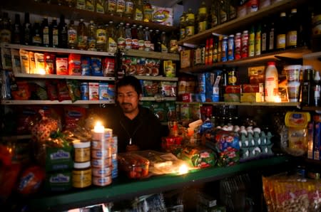 A vendor waits for customers during a national blackout, in Buenos Aires