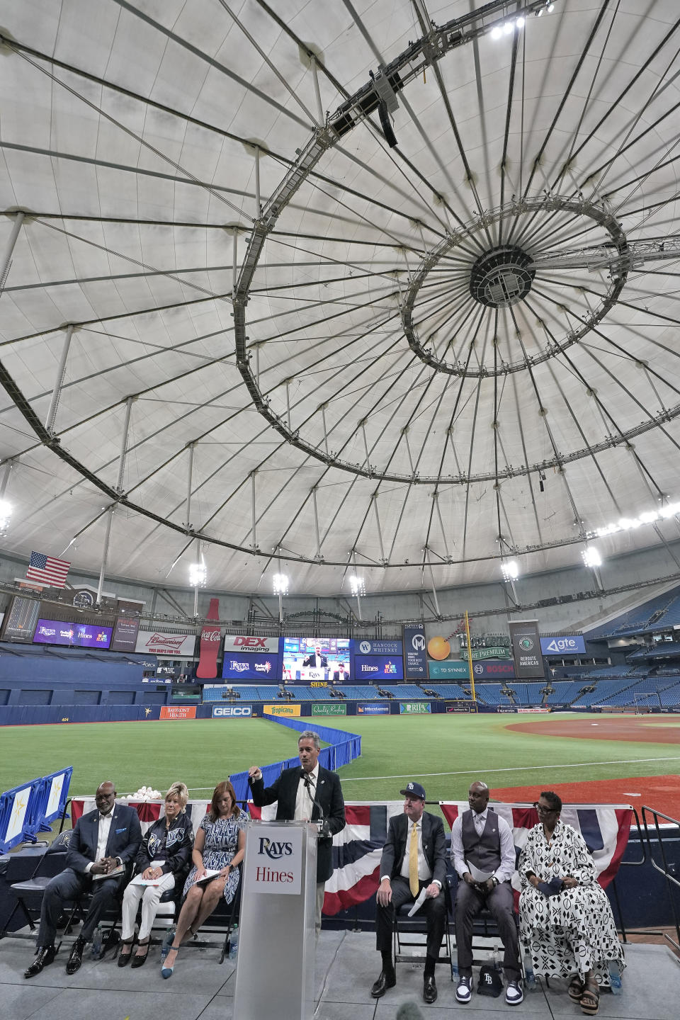 Tampa Bay Rays owner Stuart Sternberg, center, behind podium, speaks to invited guests and members of the media at Tropicana Field as the baseball team announced plans for a new stadium during a news conference Tuesday, Sept. 19, 2023, in St. Petersburg, Fla. (AP Photo/Chris O'Meara)