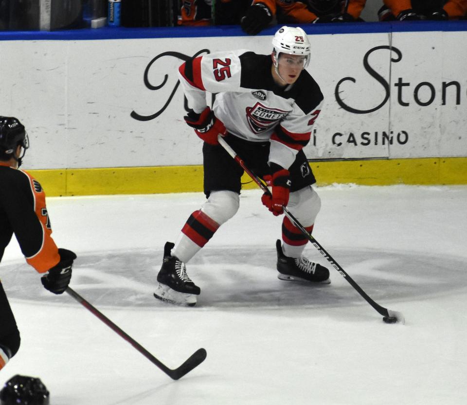 The Utica Comets' Nolan Foote looks to move the puck against Lehigh Valley on Friday, Dec. 31, 2021. The Comets lost 6-5 in overtime.