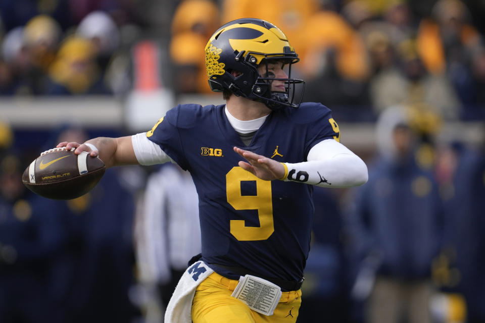 Michigan quarterback J.J. McCarthy (9) throws against Illinois in the first half of an NCAA college football game in Ann Arbor, Mich., Saturday, Nov. 19, 2022. (AP Photo/Paul Sancya)