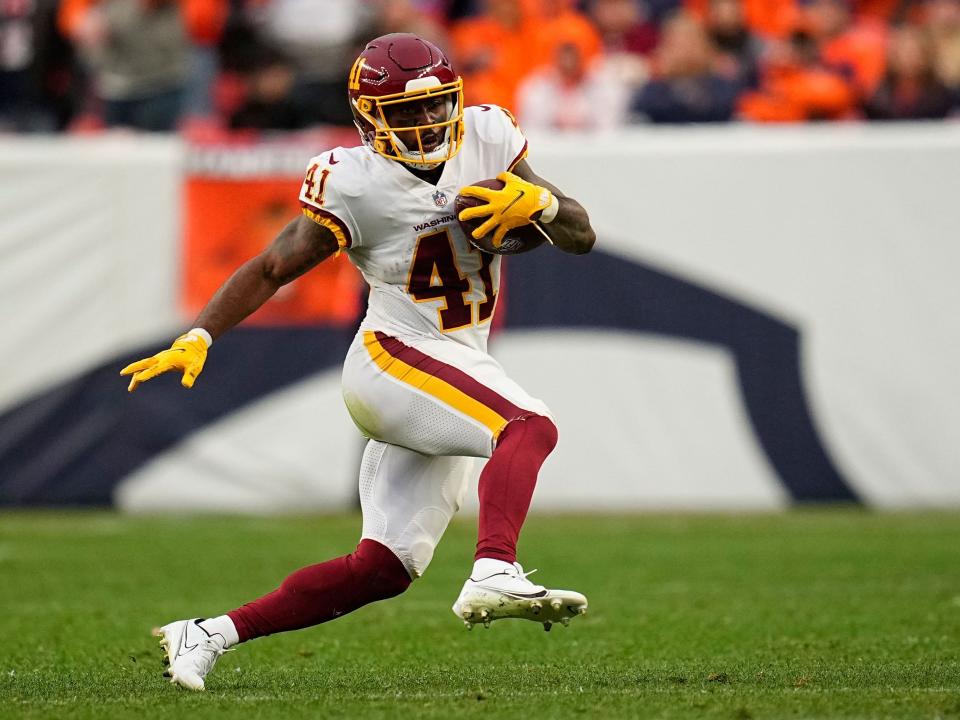 J.D. McKissic makes a run against the Denver Broncos.