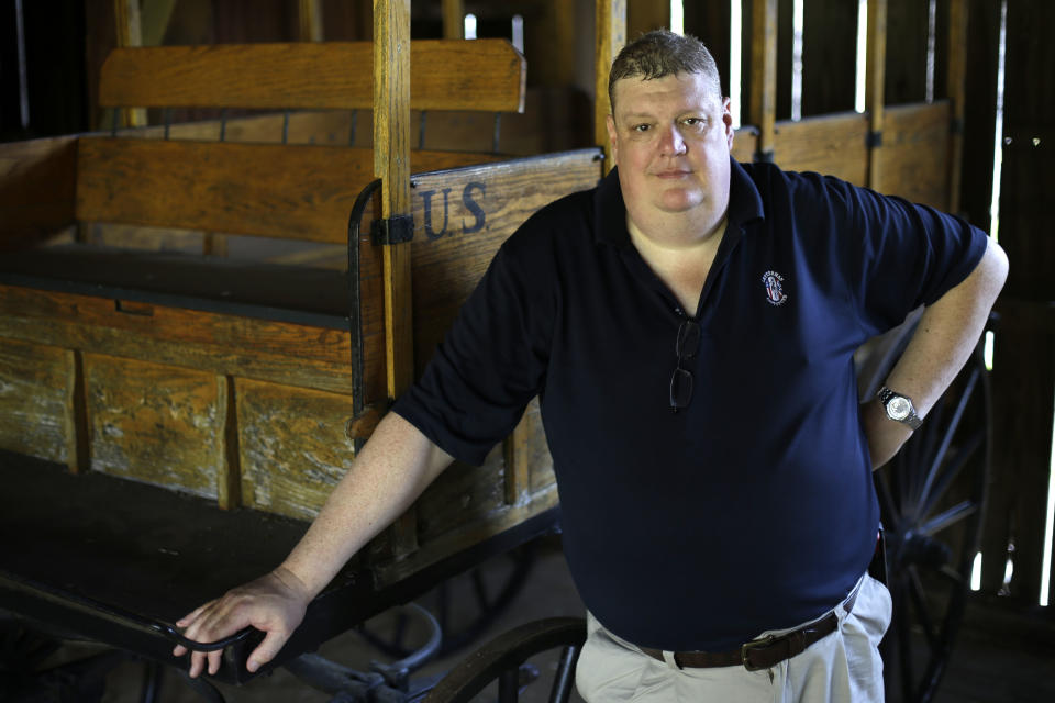 George Wunderlich, director of the National Museum of Civil War Medicine, poses for a portrait with a replica of a Rucker ambulance at the Pry House Field Hospital Museum Friday, June 21, 2013, in Keedysville, MD. The house is located on the Antietam Battlefield, which served both as Union General George McClellan's and Union Army Maj. Dr. Jonathan Letterman's headquarters during the battle. As gunshots ravaged the bodies of tens of thousands of soldiers at the Battle of Gettysburg, military doctors responded with a method of treatment that is still the foundation of combat medicine today. (AP Photo/Matt Rourke)