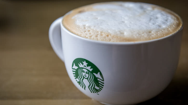 Cappuccino in white Starbucks mug