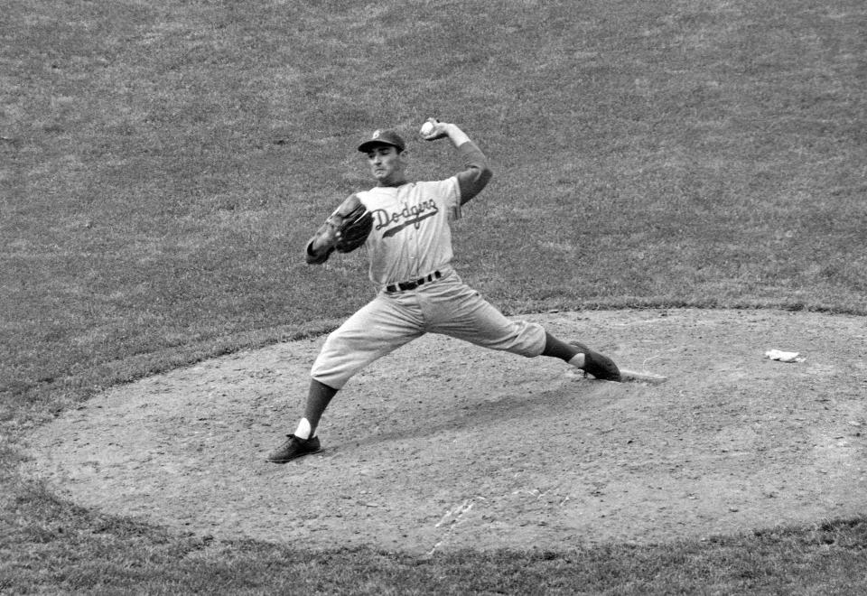 Brooklyn Dodgers southpaw Sandy Koufax pitches against the Chicago Cubs May 16, 1957, in Chicago.