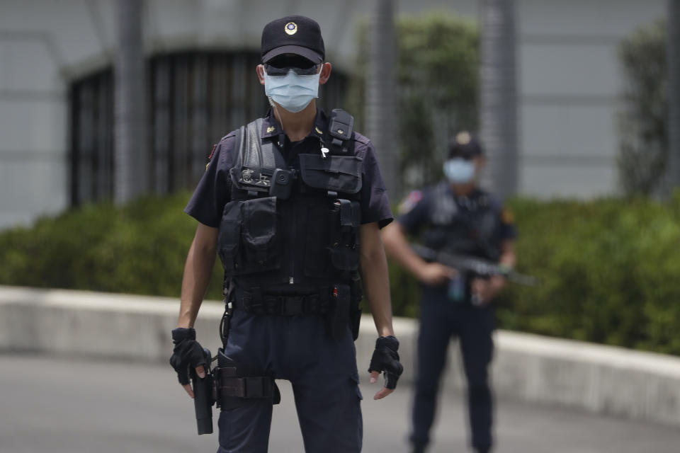 Soldiers guard outside the President Office as visiting U.S. House Speaker Nancy Pelosi meeting with Taiwan President Tsai Ing-wen in Taipei, Taiwan, Wednesday, Aug 3, 2022. Pelosi arrived in Taiwan late Tuesday, becoming the highest-ranking American official in 25 years to visit the self-ruled island claimed by China, which quickly announced that it would conduct military maneuvers in retaliation for her presence. (AP Photo/Chiang Ying-ying)