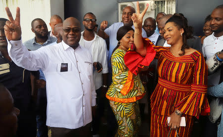 FILE PHOTO: Felix Tshisekedi, leader of the Congolese main opposition party, the Union for Democracy and Social Progress (UDPS), and a presidential candidate, shows a victory sign after casting his ballot at a polling station in Kinshasa, Democratic Republic of Congo, December 30, 2018. REUTERS/Kenny Katombe/File Photo