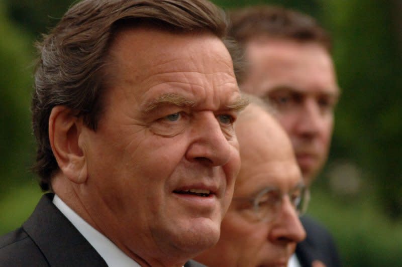 German Chancellor Gerhard Schroeder (C) arrives at the White House with his escort on June 27, 2005. On September 27, 1998, Schroeder led Germany's Social Democratic Party to victory in parliamentary elections, bringing to an end 16 years of power by Chancellor Helmut Kohl and his Christian Democratic Party. File Photo by Roger L. Wollenberg/UPI