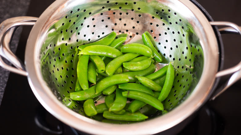 sugar snap peas in steamer basket