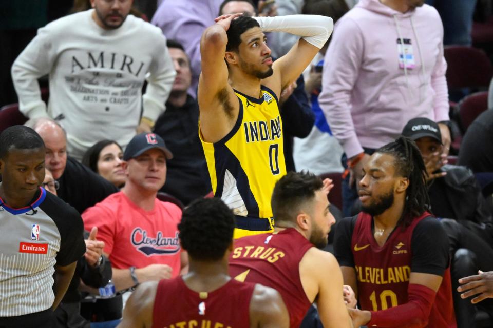 Apr 12, 2024; Cleveland, Ohio, USA; Indiana Pacers guard Tyrese Haliburton (0) reacts after he fouled Cleveland Cavaliers guard Max Strus (1) on a three-point basket attempt in the fourth quarter at Rocket Mortgage FieldHouse. Mandatory Credit: David Richard-USA TODAY Sports