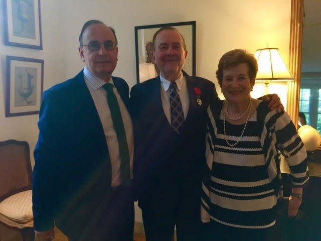 From left, Consul General of France Valery Freland, Dr. Mel B. Yoken exhibiting the French Legion of Honor Medal, and his wife, Cindy Yoken. [Submitted photo]